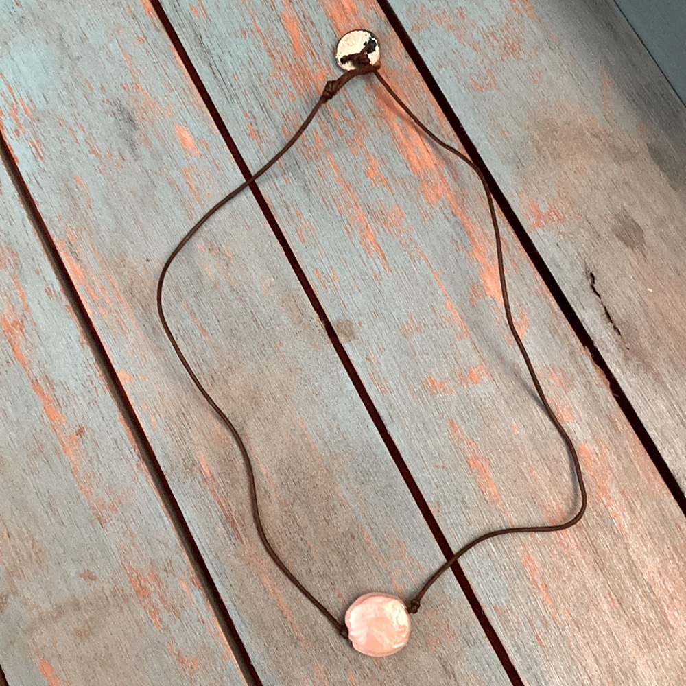 Necklace with leather band and loop clasp